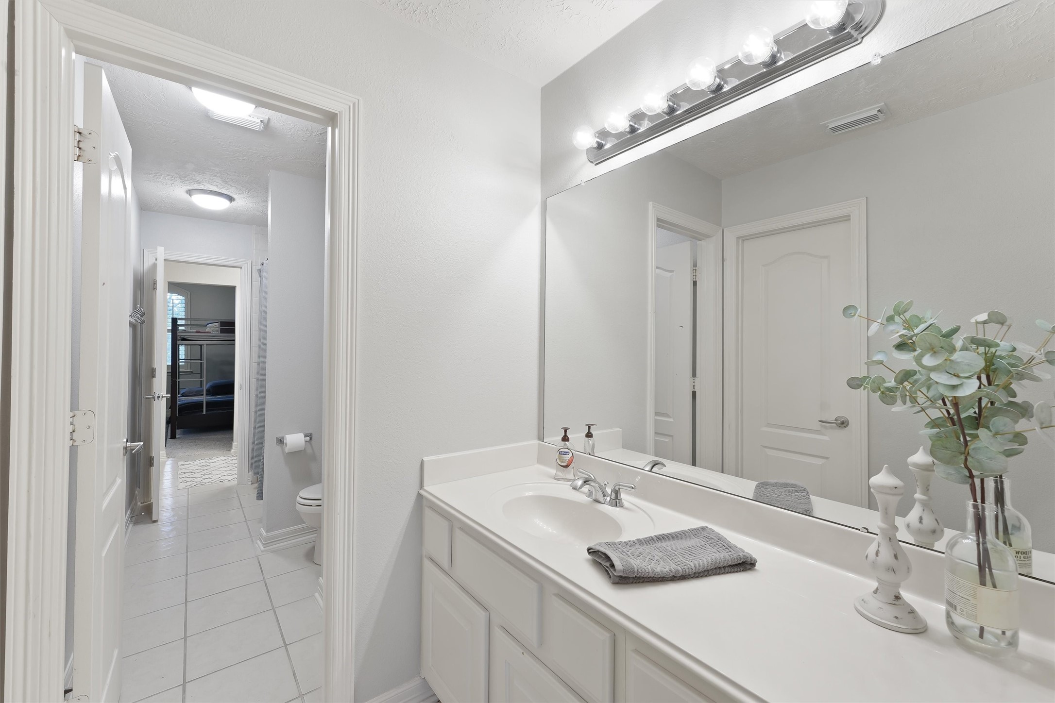 2818 Shallow Springs Court Manvel, TX 77578 - Photo 28 of 41 a bathroom with a sink and a mirror