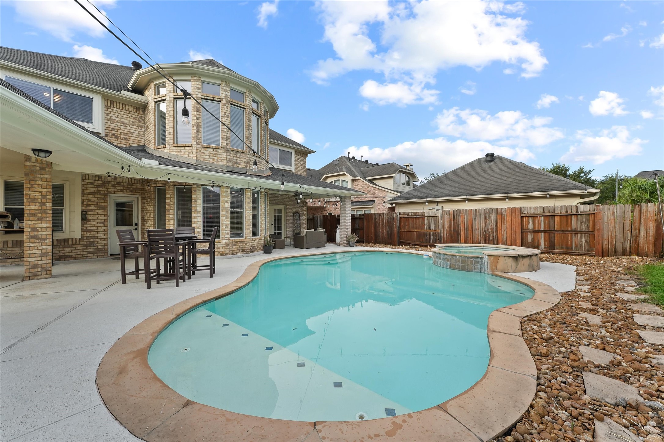2818 Shallow Springs Court Manvel, TX 77578 - Photo 33 of 41 a view of a house with a swimming pool