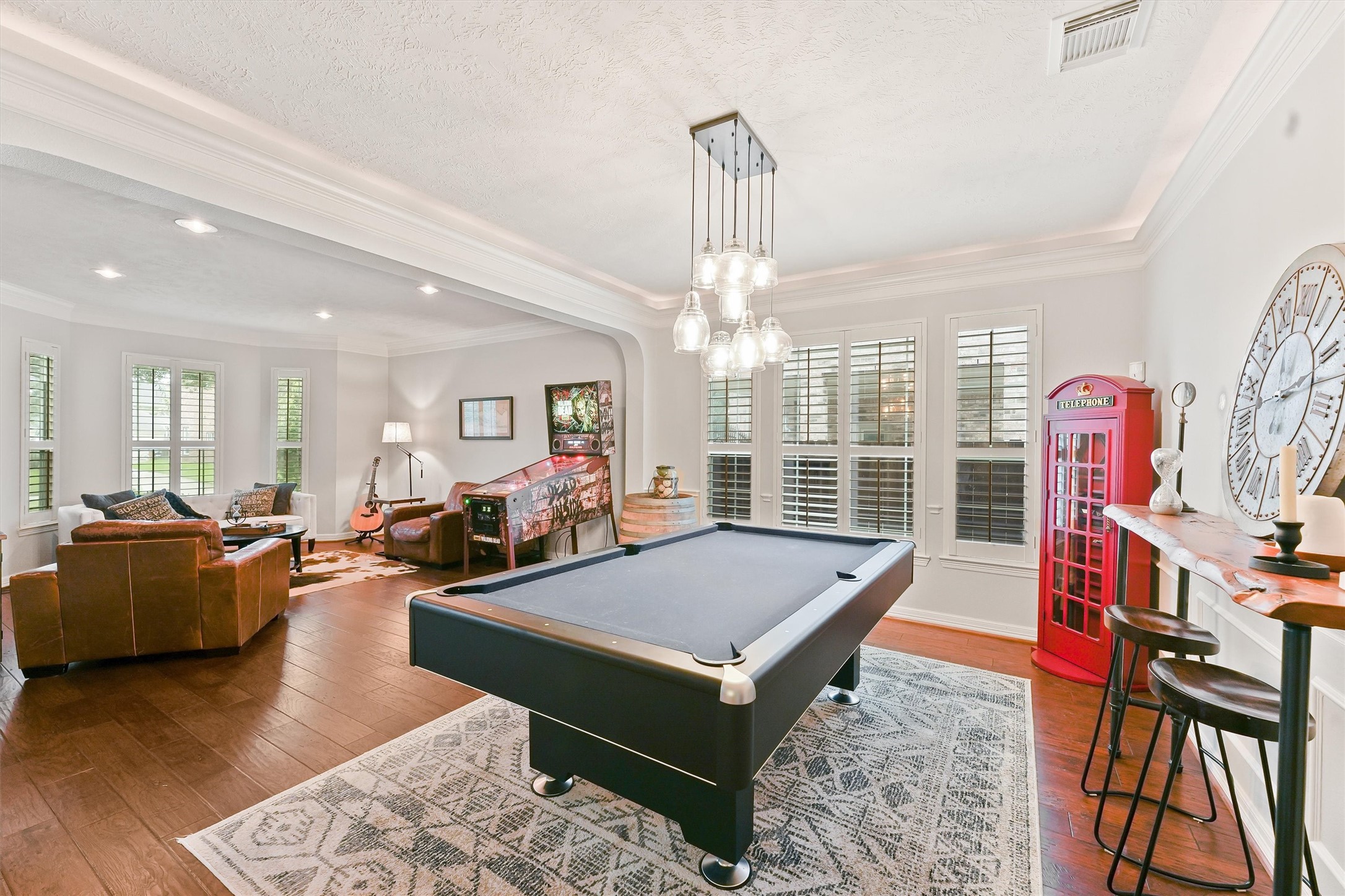 2818 Shallow Springs Court Manvel, TX 77578 - Photo 8 of 41 a living room with furniture a rug and a chandelier