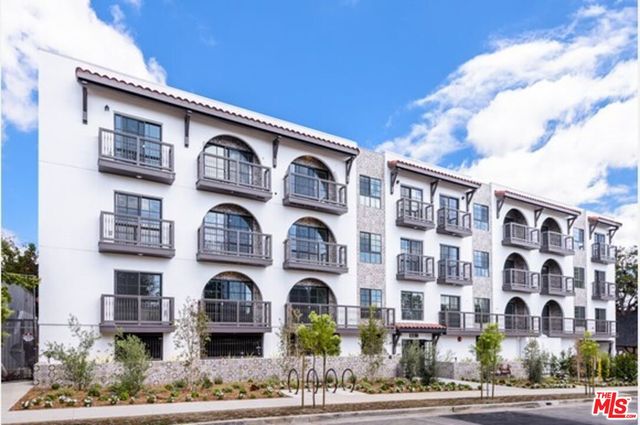 a front view of a building with street view