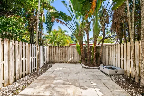 a view of a brick house with large windows