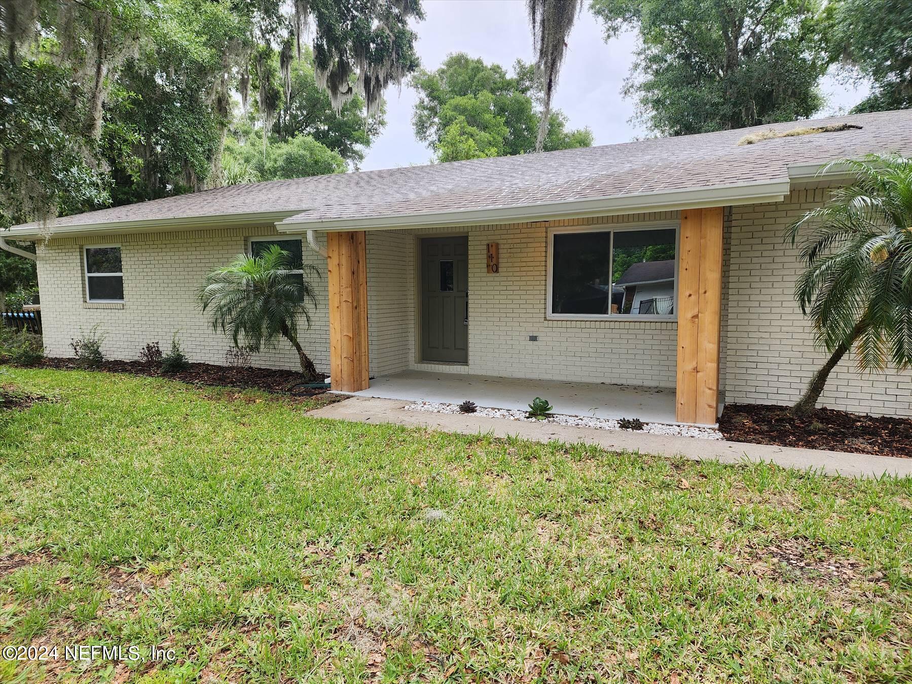 110 Faun Road St. Augustine, FL 32086 - Photo 1 of 4 a front view of house with yard
