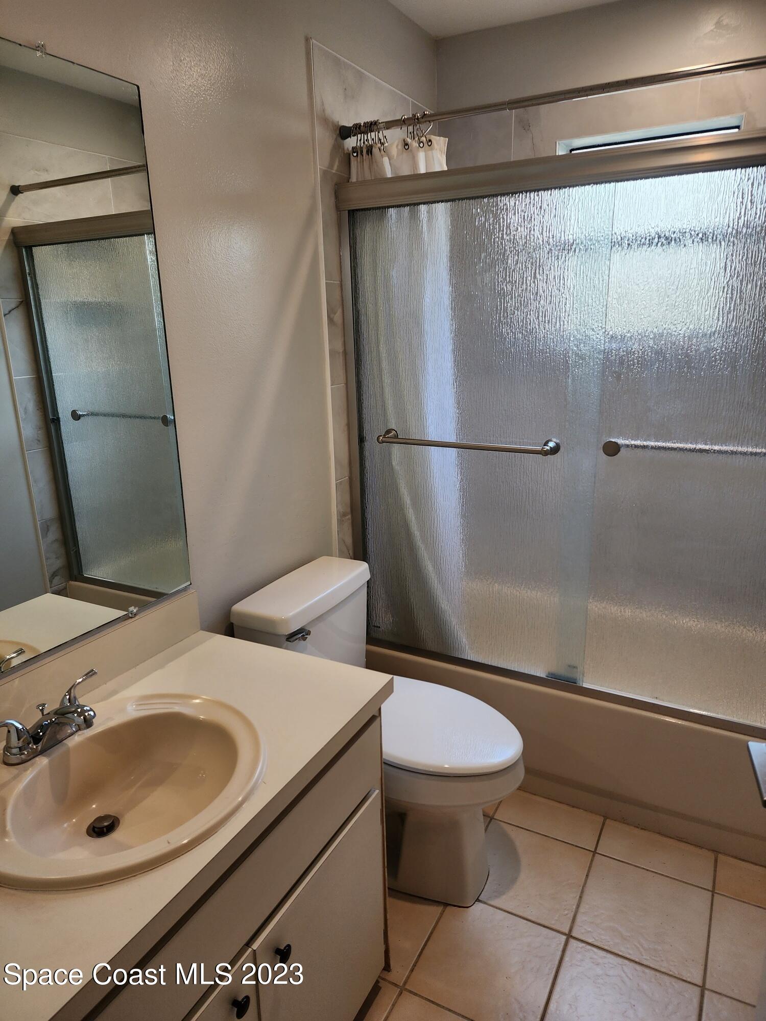 708 Fishtail Palm Boulevard Melbourne, FL 32901 - Photo 17 of 33 a bathroom with a sink toilet and shower