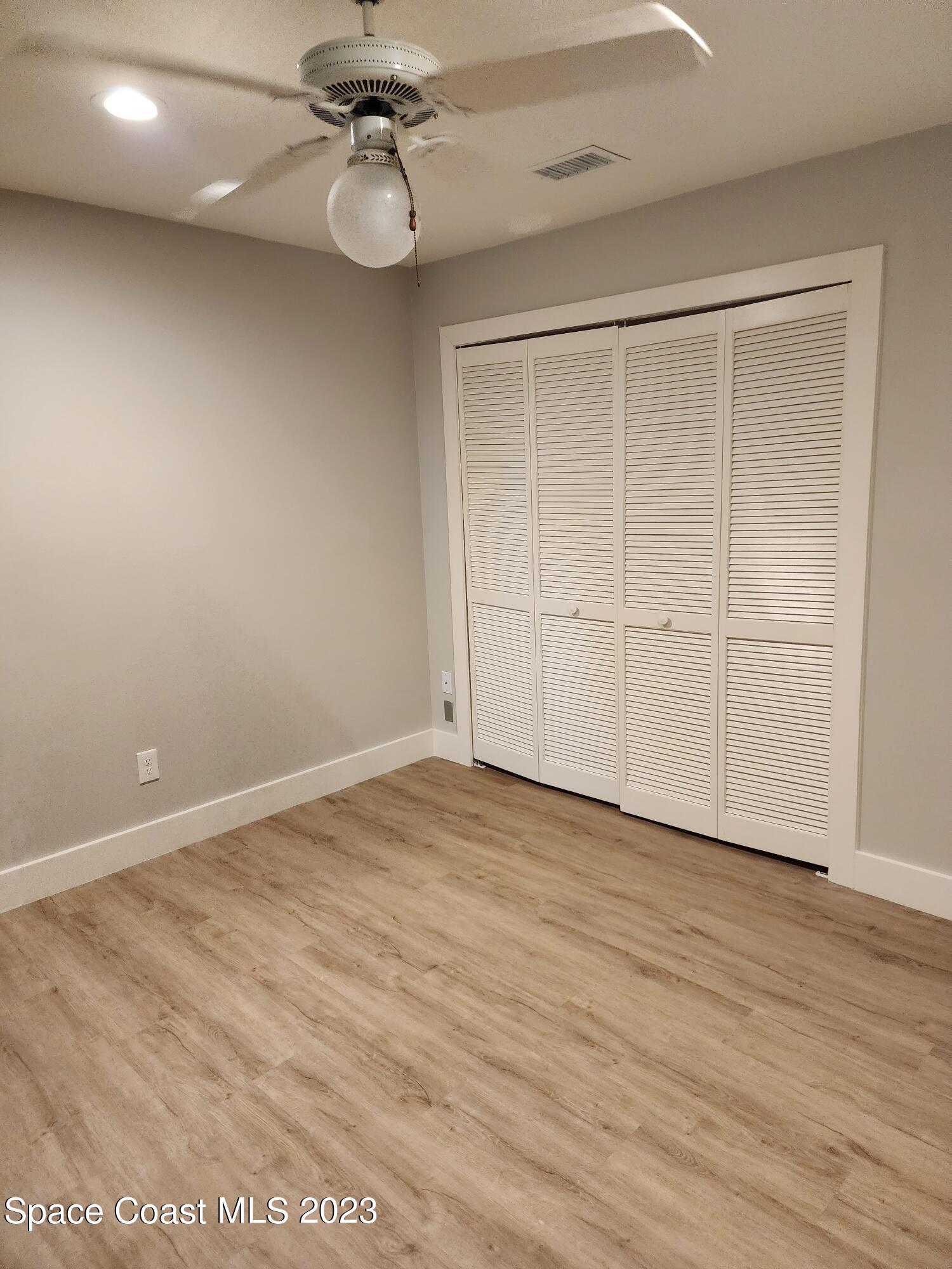 708 Fishtail Palm Boulevard Melbourne, FL 32901 - Photo 20 of 33 wooden floor in an empty room