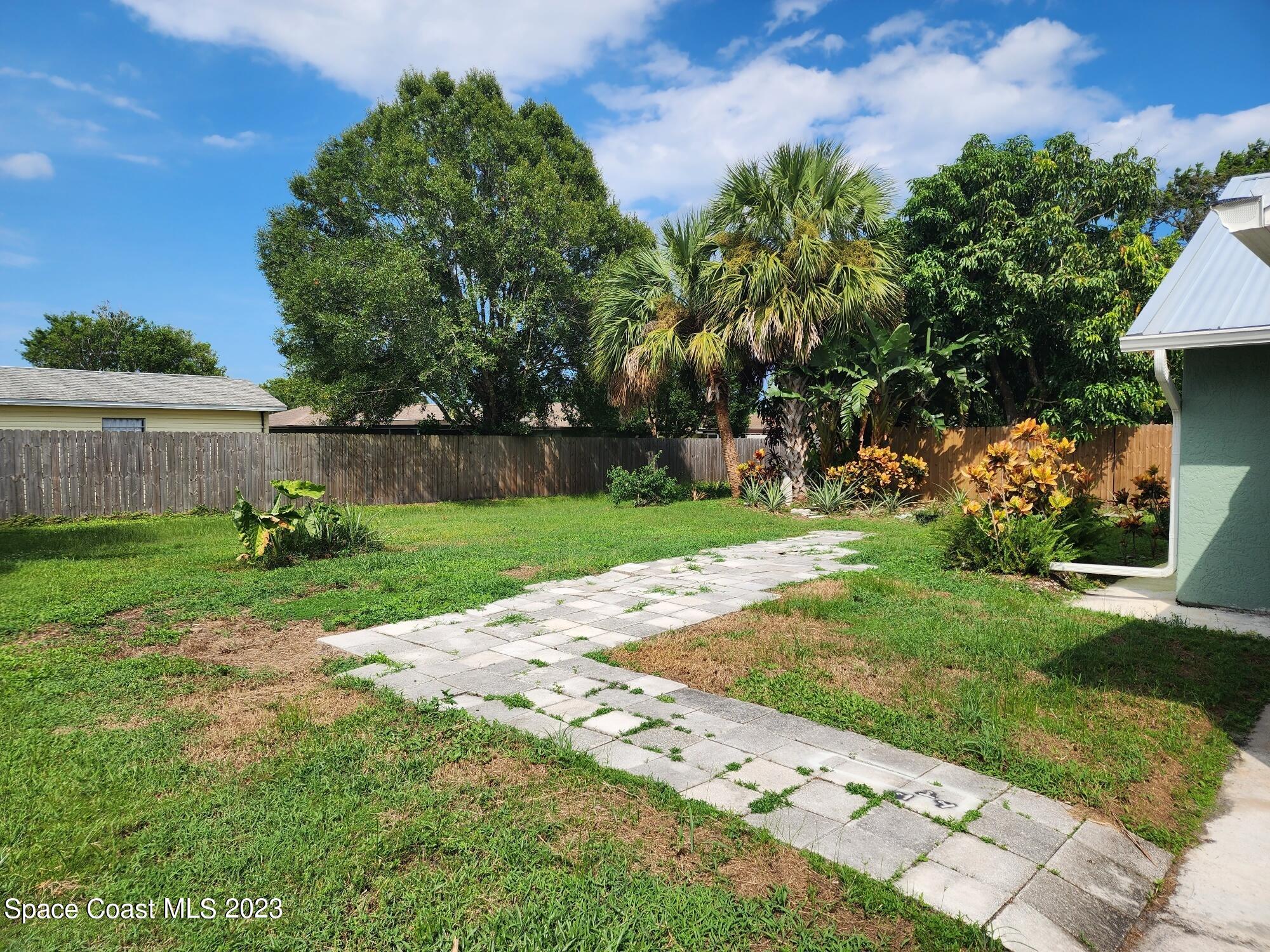 708 Fishtail Palm Boulevard Melbourne, FL 32901 - Photo 29 of 33 a view of backyard with sitting area