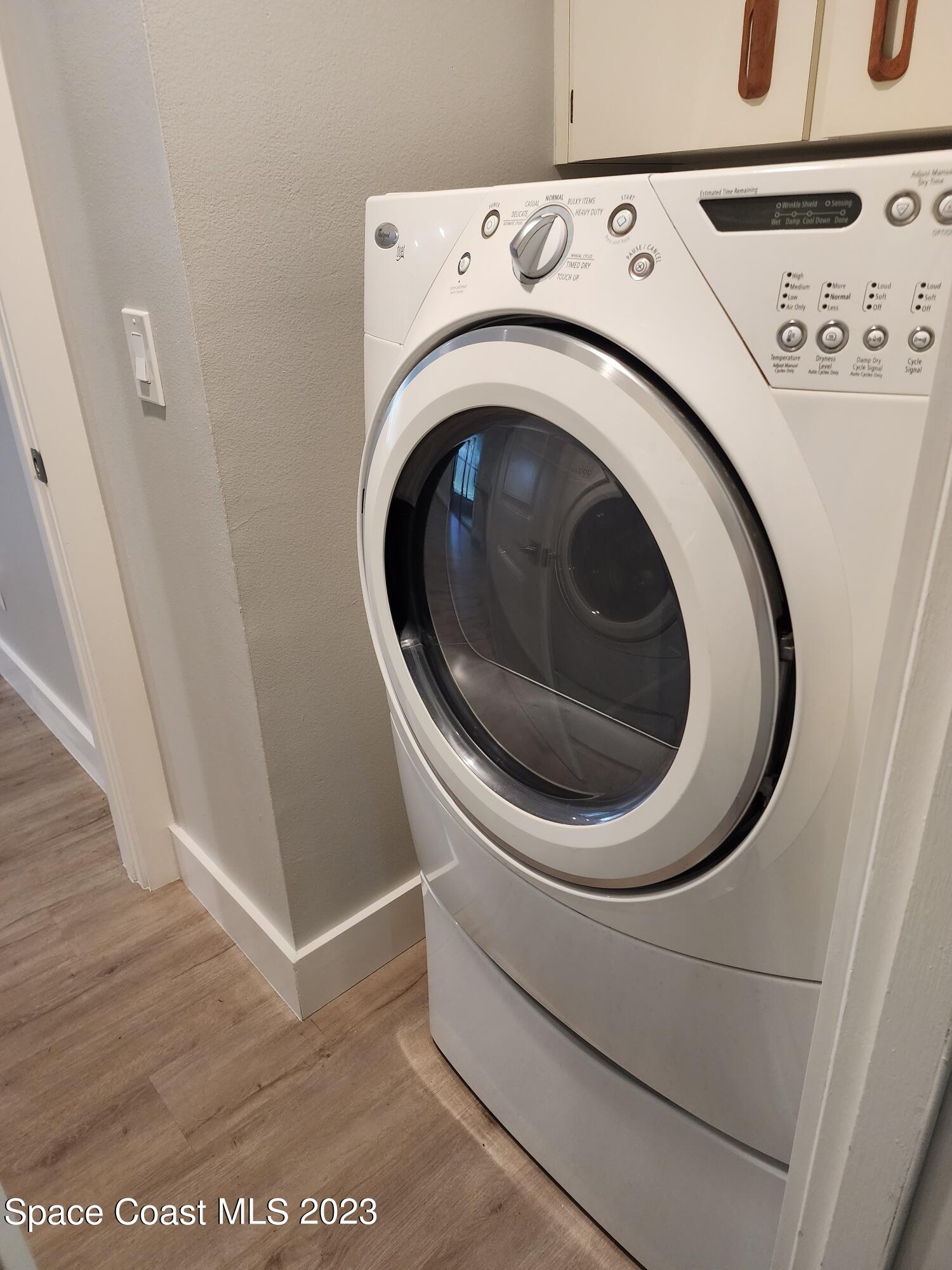 708 Fishtail Palm Boulevard Melbourne, FL 32901 - Photo 31 of 33 a utility room with dryer and washer