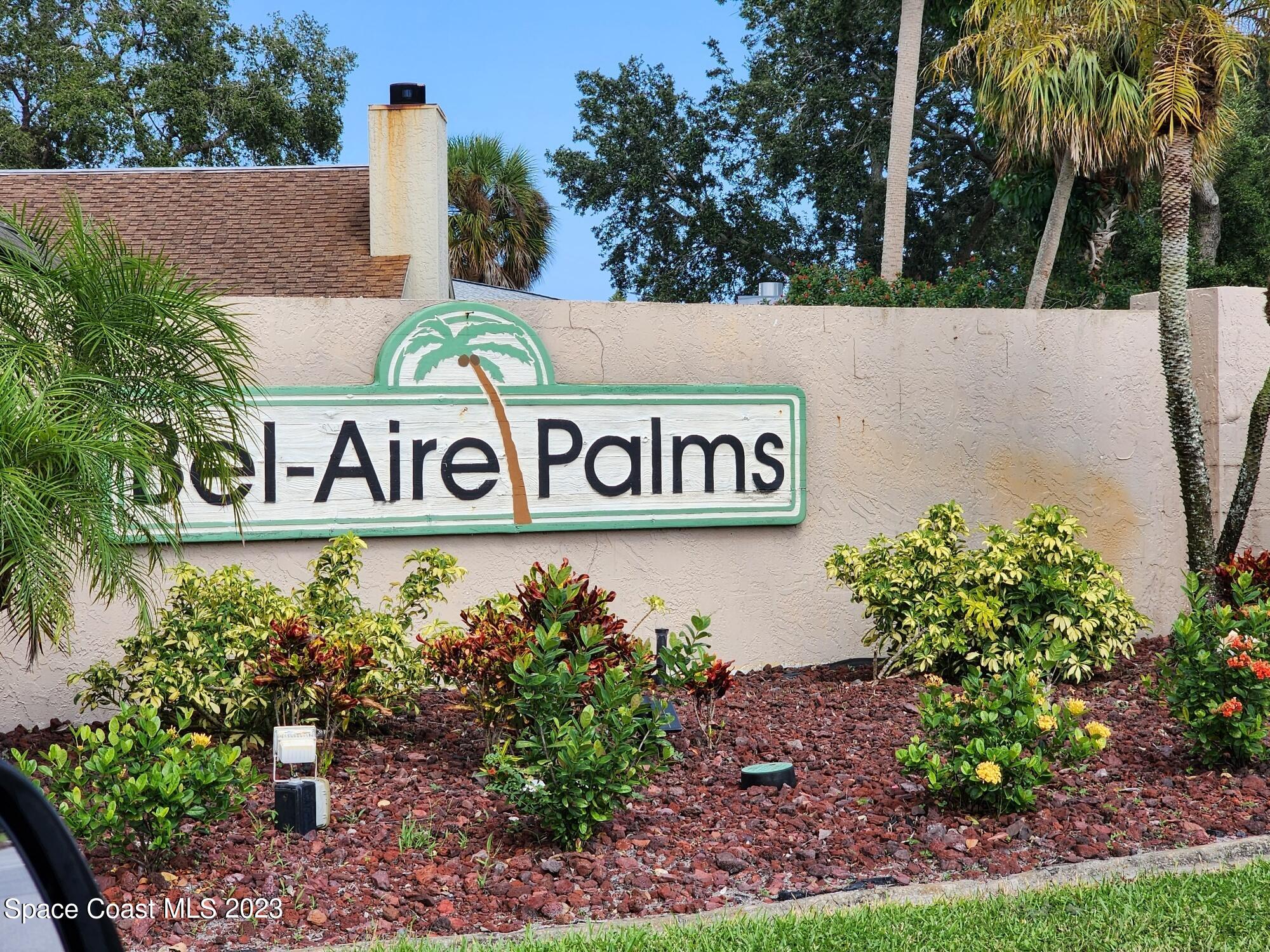 708 Fishtail Palm Boulevard Melbourne, FL 32901 - Photo 5 of 33 a sign broad in front of flowers