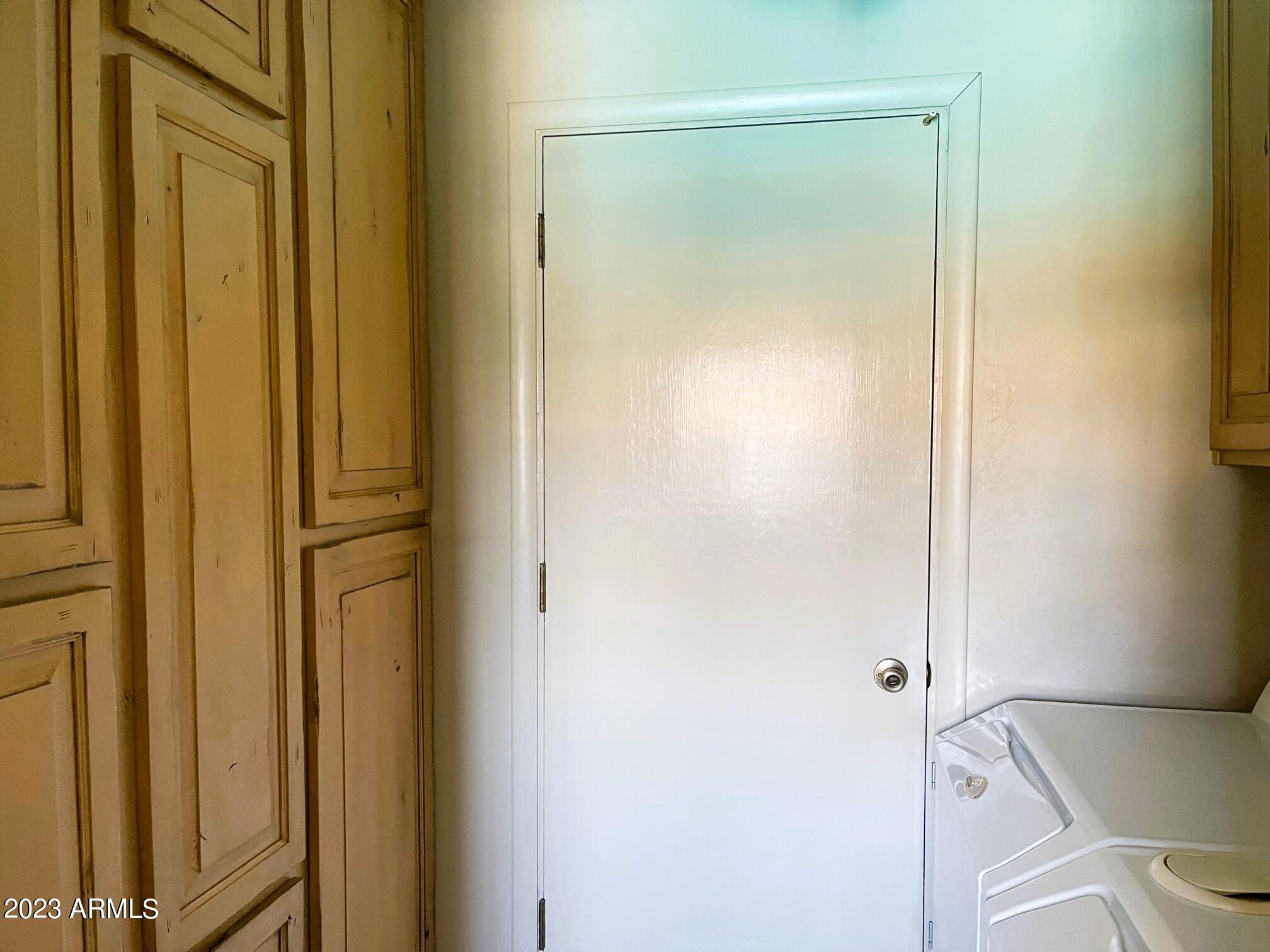 4106 West Hatcher Road Phoenix, AZ 85051 - Photo 7 of 8 Built in cabinets and ironing board in L