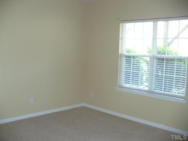 5316 Berry Creek Circle Raleigh, NC 27613 - Photo 3 of 9 an empty room with a window