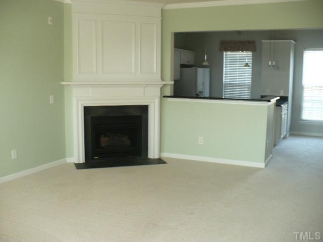 5316 Berry Creek Circle Raleigh, NC 27613 - Photo 5 of 9 a view of a livingroom with a fireplace and cabinet
