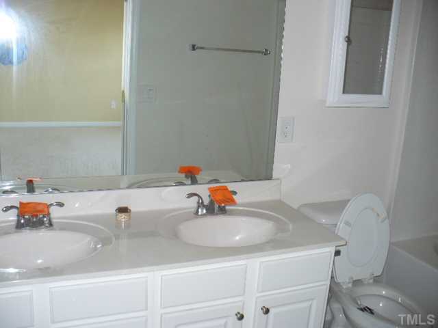 5316 Berry Creek Circle Raleigh, NC 27613 - Photo 8 of 9 a bathroom with a sink and a toilet