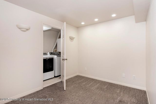 a view of storage and utility room with washer and dryer