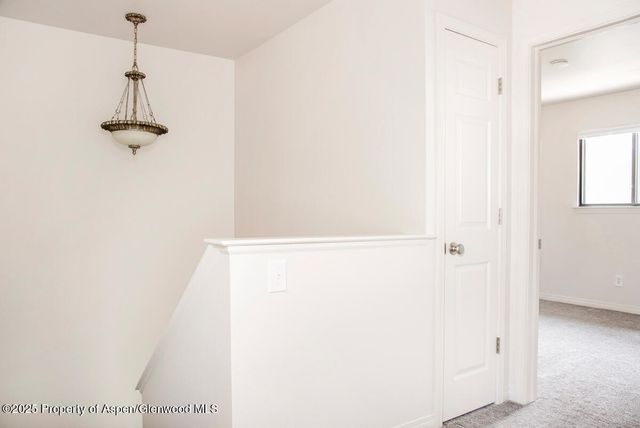 a view of a hallway with a shower