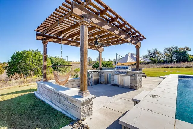 a view of a swimming pool with a patio