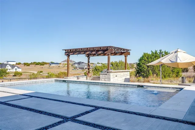 an outdoor space with lounge chair