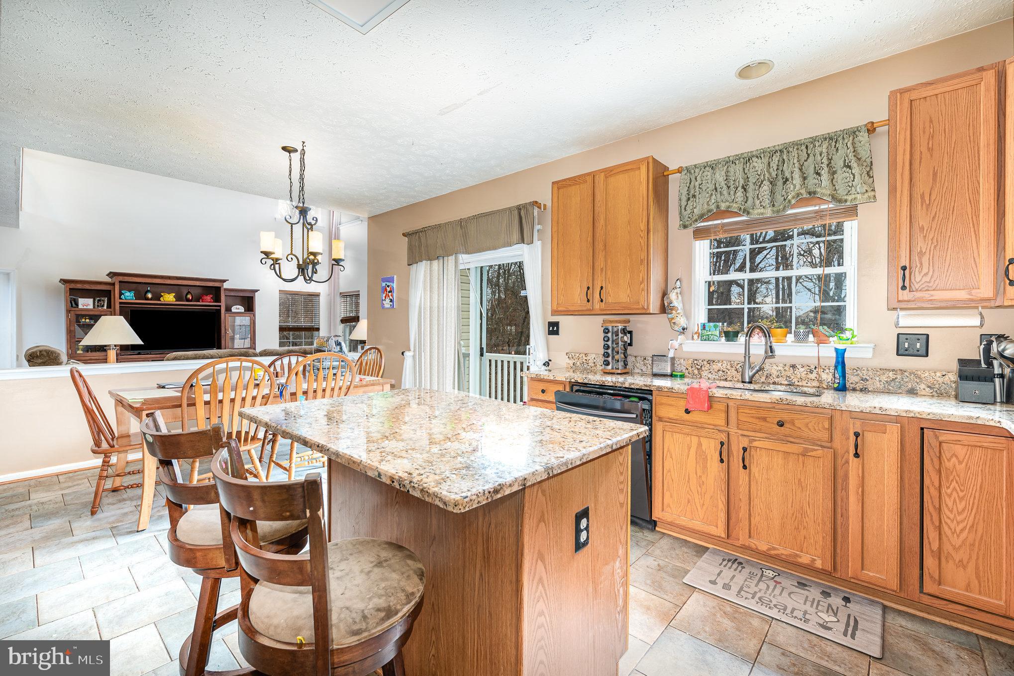 145 West Heather Road Bel Air, MD 21014 - Photo 18 of 47 a kitchen with a dining table chairs and white cabinets
