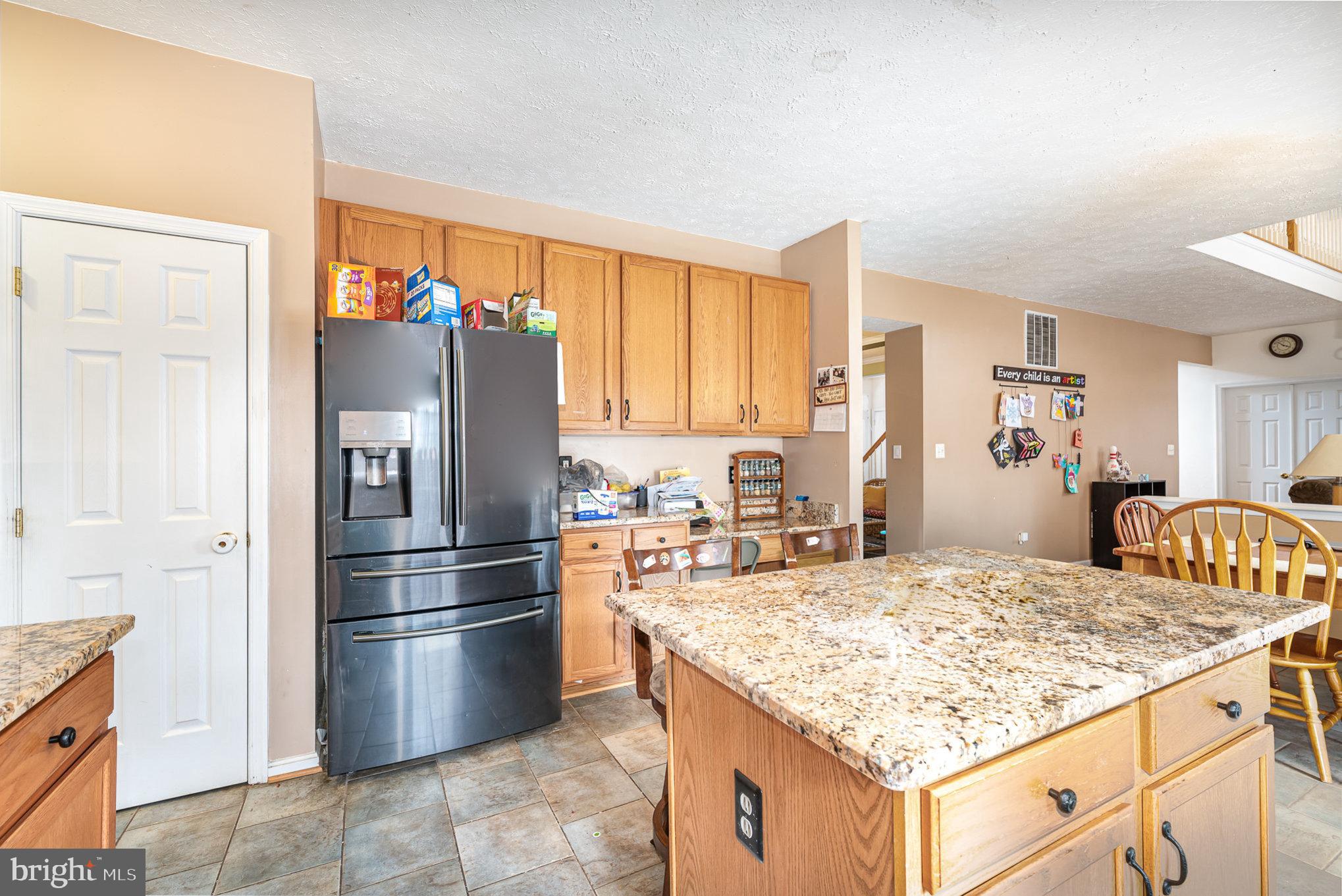 145 West Heather Road Bel Air, MD 21014 - Photo 19 of 47 a kitchen with stainless steel appliances granite countertop a sink stove and refrigerator