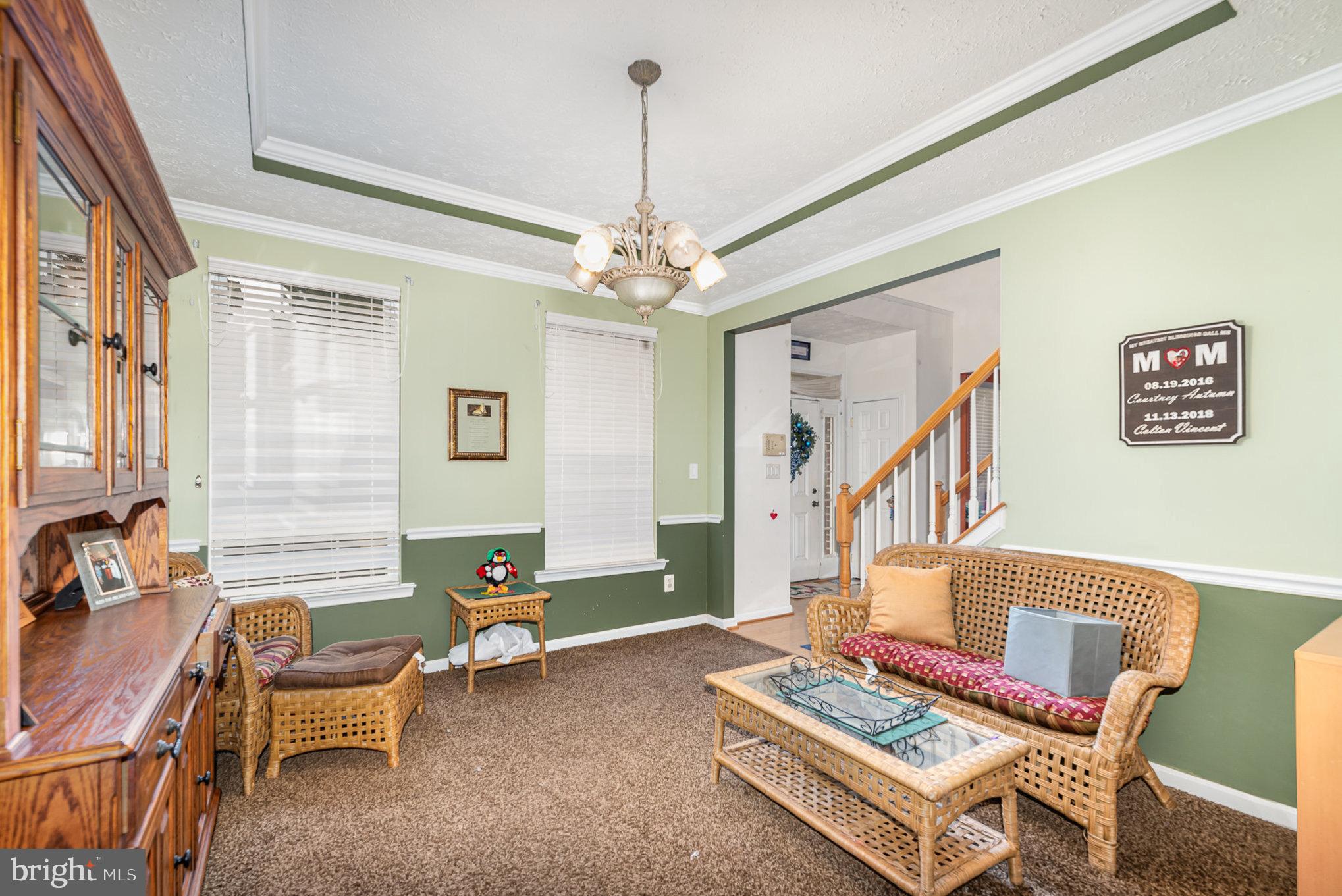 145 West Heather Road Bel Air, MD 21014 - Photo 20 of 47 a living room with furniture and a chandelier