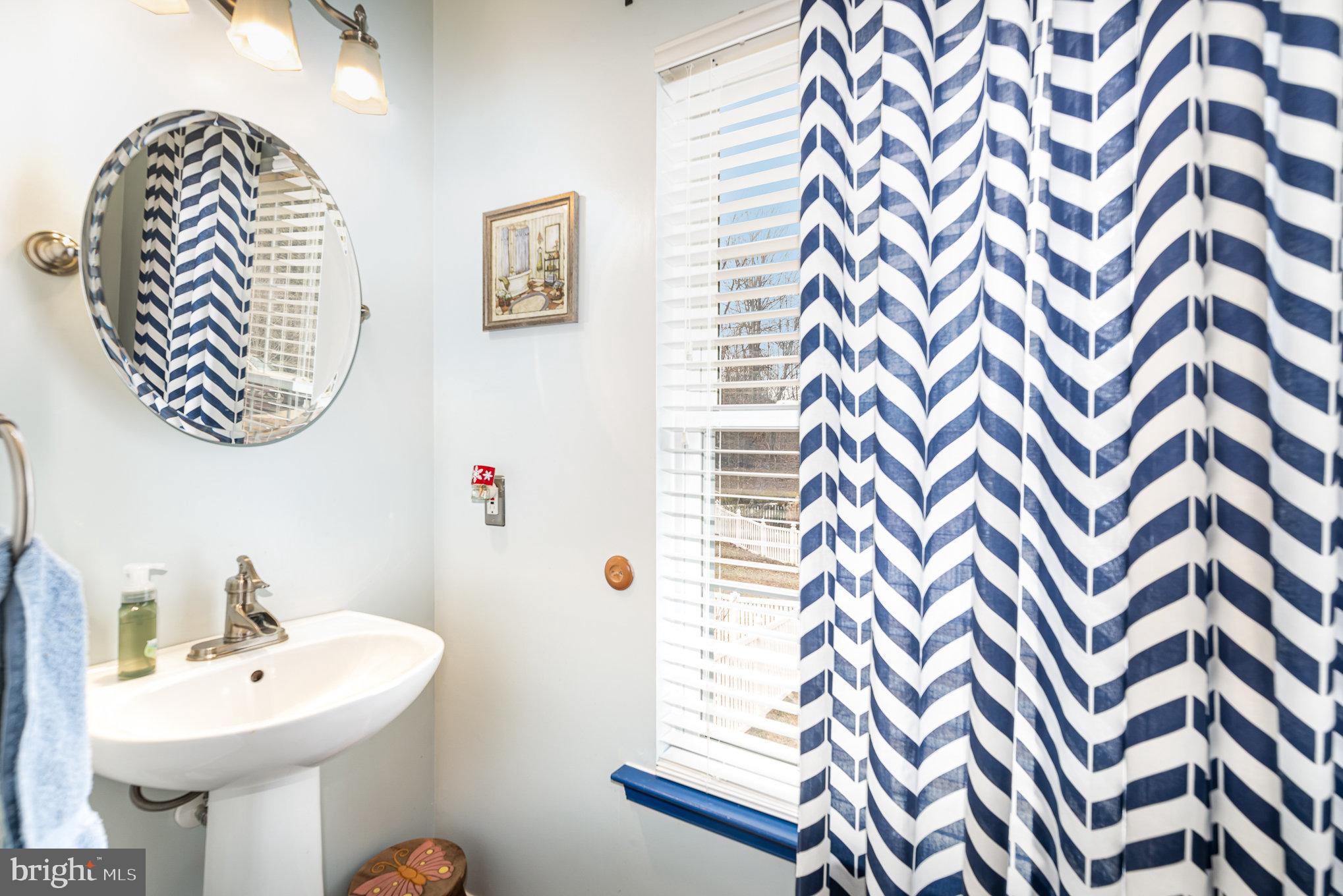 145 West Heather Road Bel Air, MD 21014 - Photo 22 of 47 a bathroom with a sink a mirror and a toilet