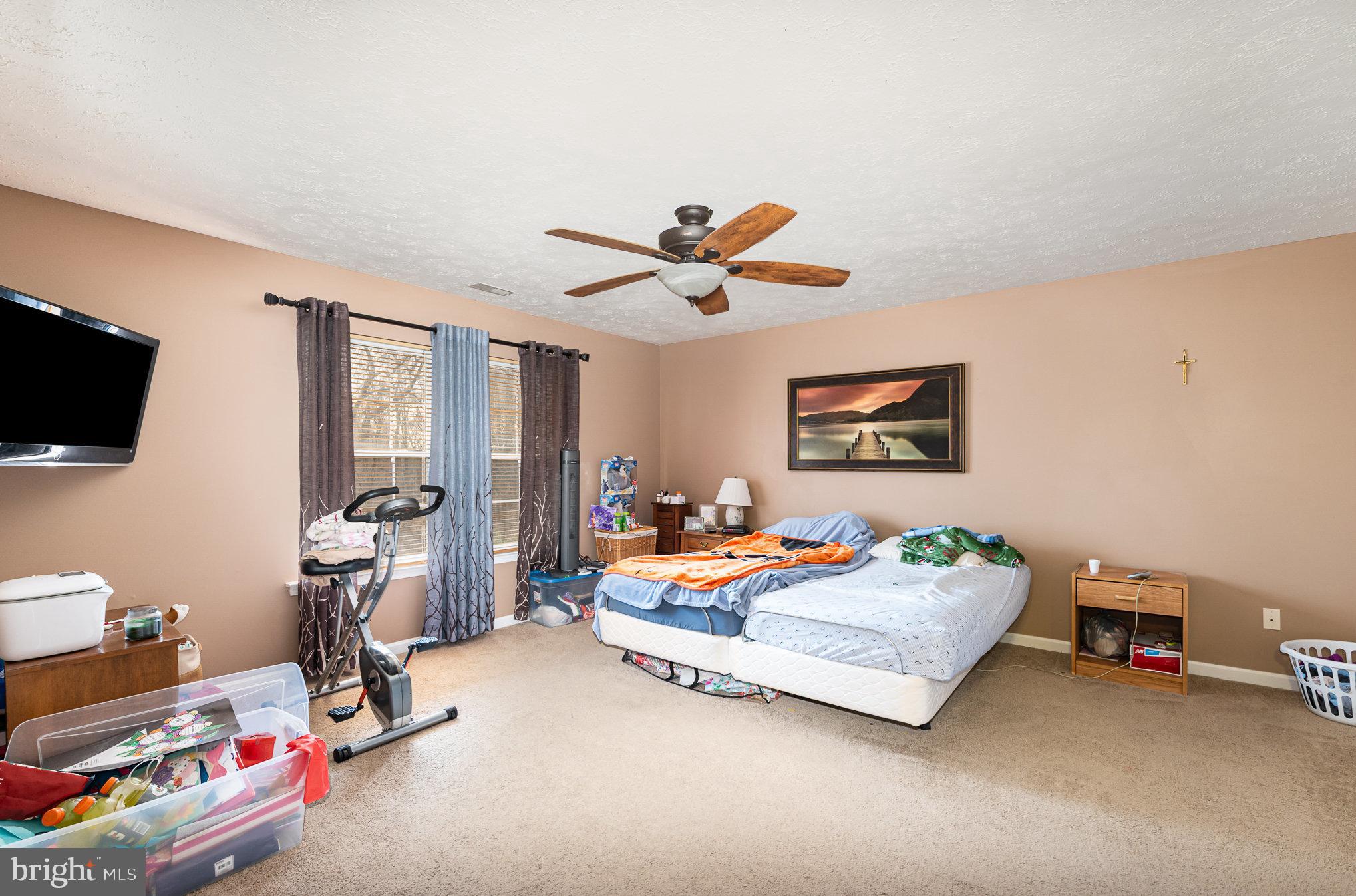 145 West Heather Road Bel Air, MD 21014 - Photo 23 of 47 a bedroom with a bed and a tv