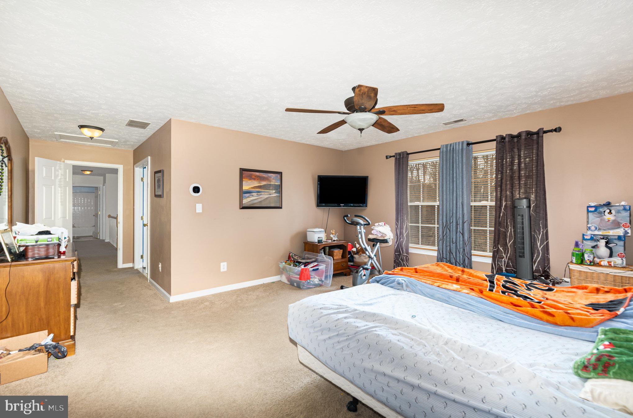 145 West Heather Road Bel Air, MD 21014 - Photo 24 of 47 a bedroom with a bed and a chandelier