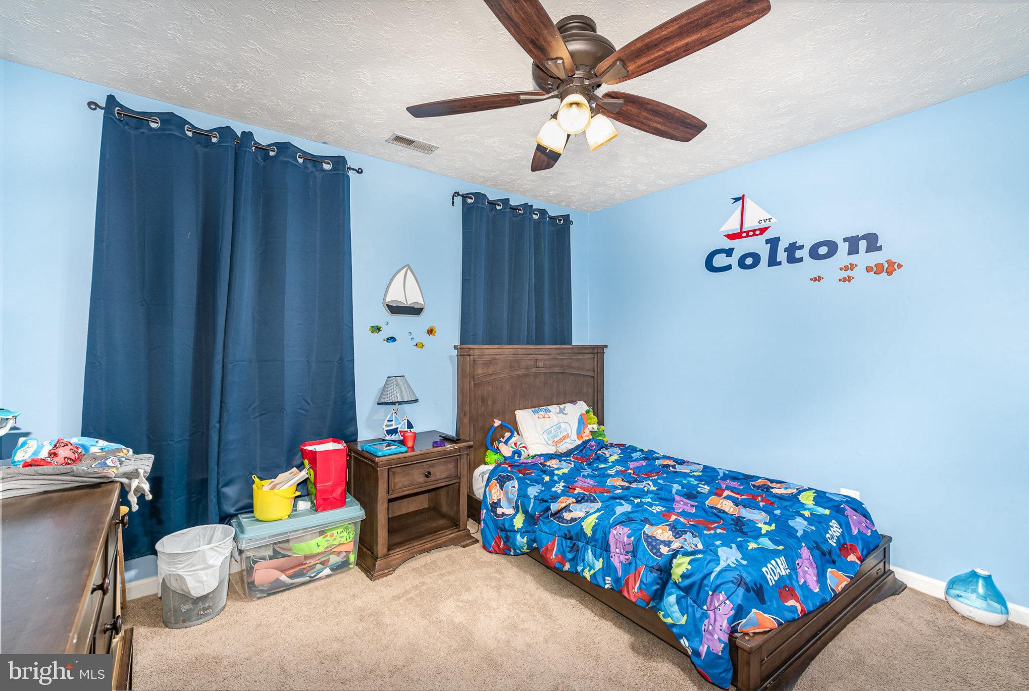 145 West Heather Road Bel Air, MD 21014 - Photo 27 of 47 a bedroom with a bed and a chandelier