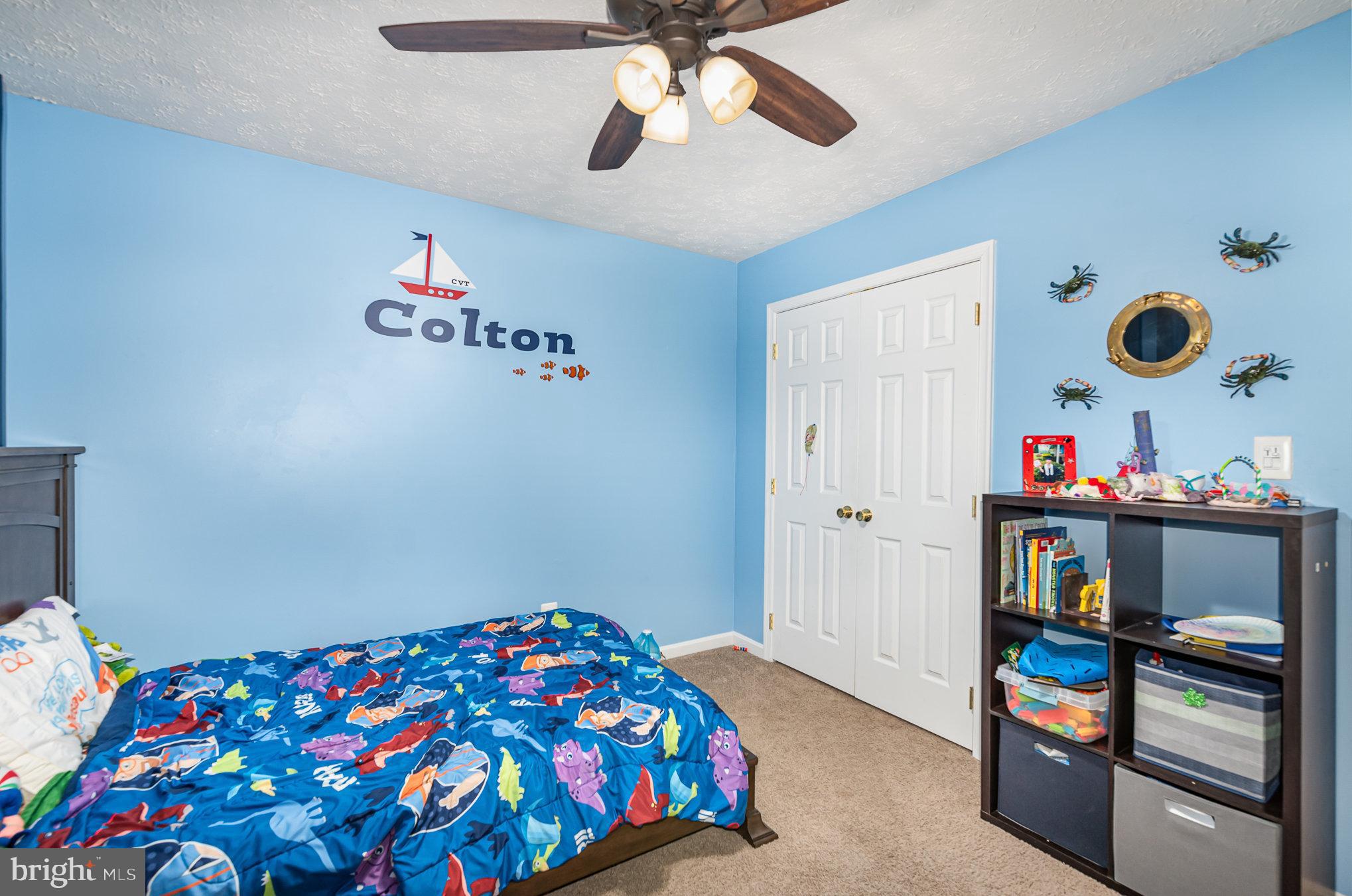 145 West Heather Road Bel Air, MD 21014 - Photo 28 of 47 a bedroom with a bed and a chandelier