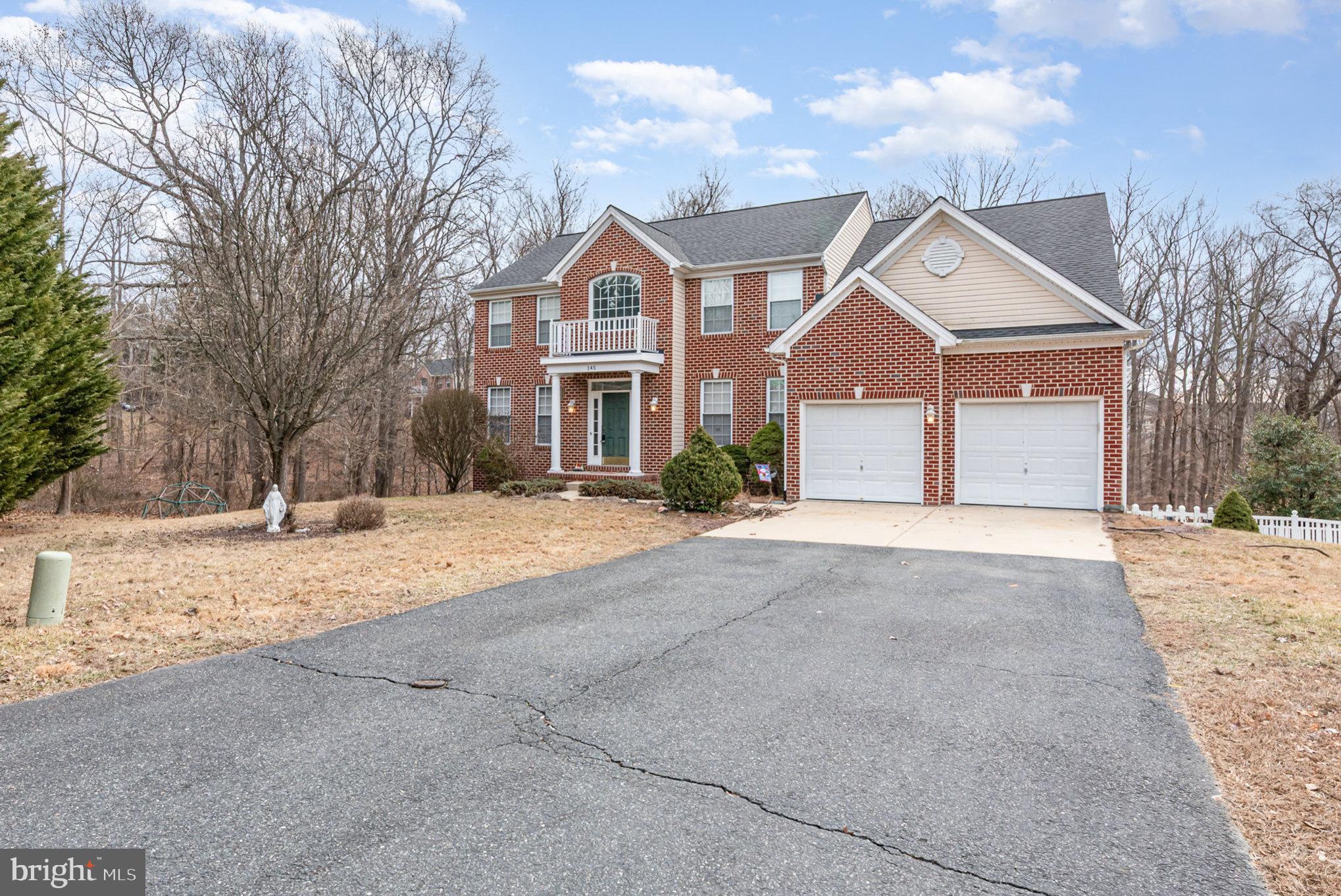 145 West Heather Road Bel Air, MD 21014 - Photo 3 of 47 a front view of a house with a yard and garage