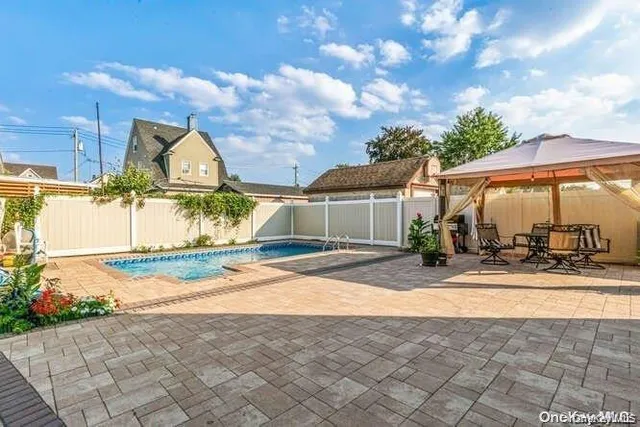 a view of a house with basketball court