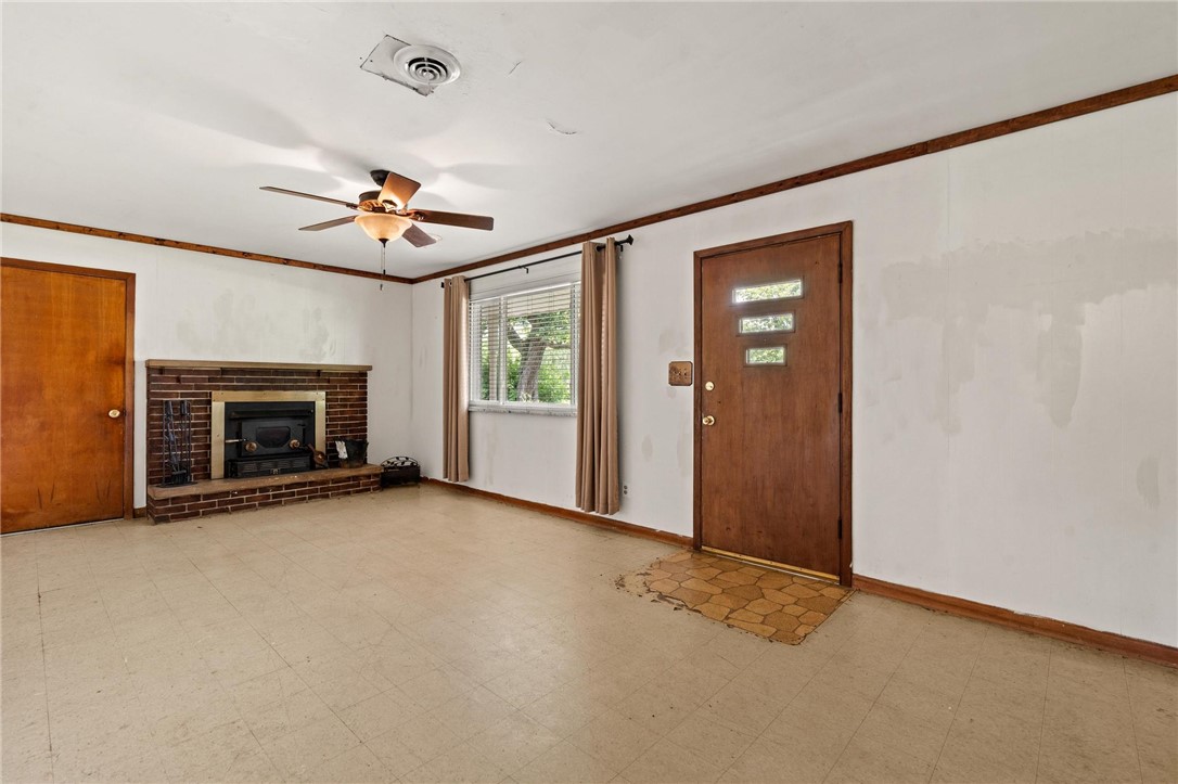 4150 Rose Marie Road Franklin, OH 45005 - Photo 13 of 36 A classic fireplace with a brick surround anchors this inviting living space.