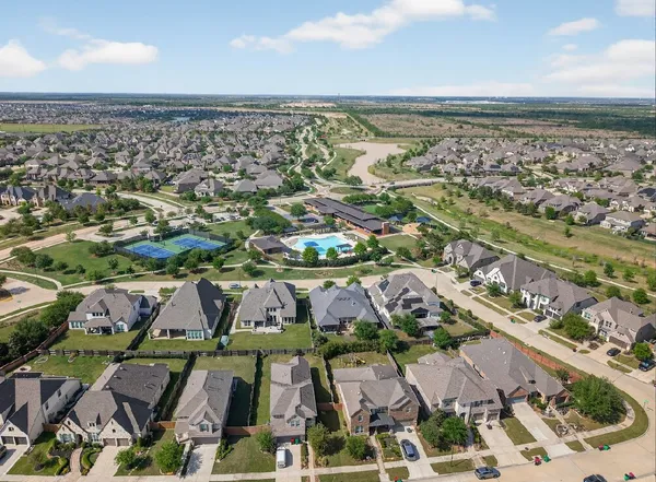 an aerial view of residential building and parking space