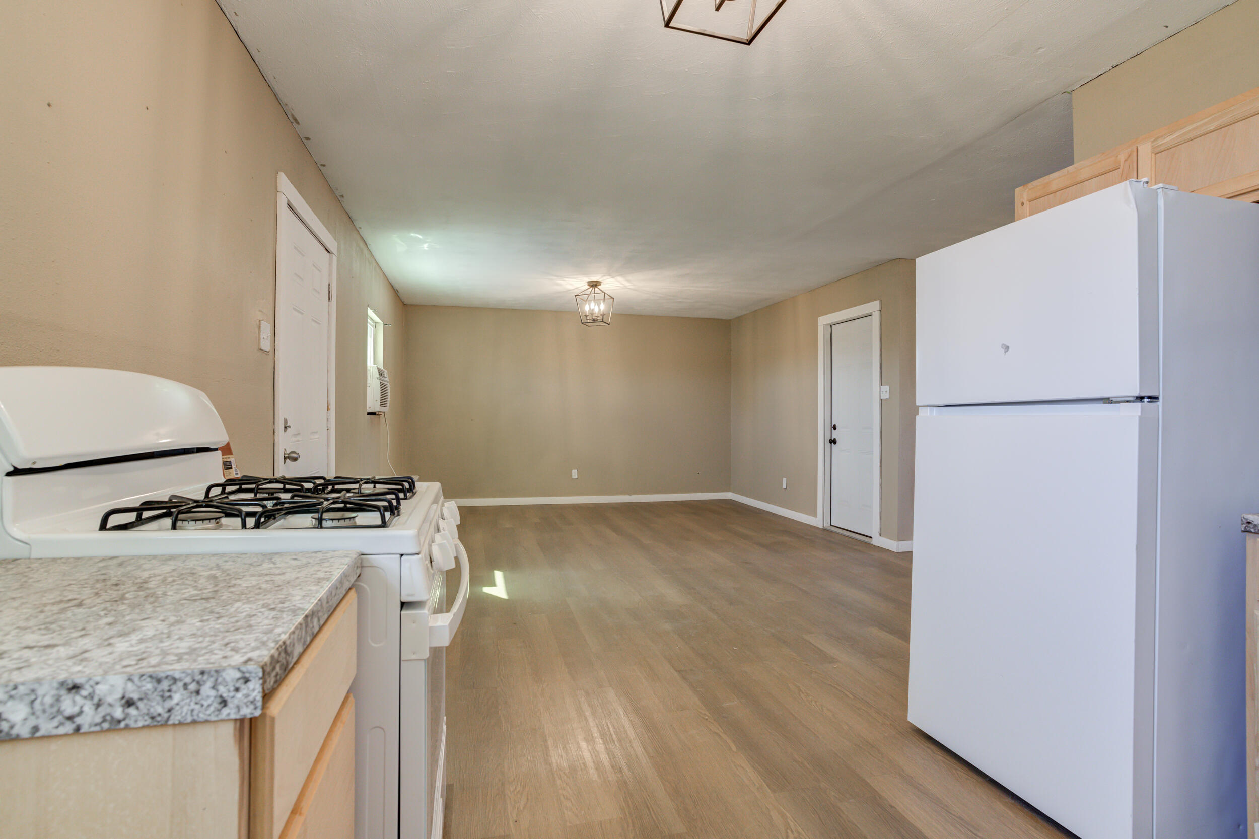 3204 East 2nd Street Lubbock, TX 79403 - Photo 18 of 34 a kitchen with a stove a refrigerator and a stove