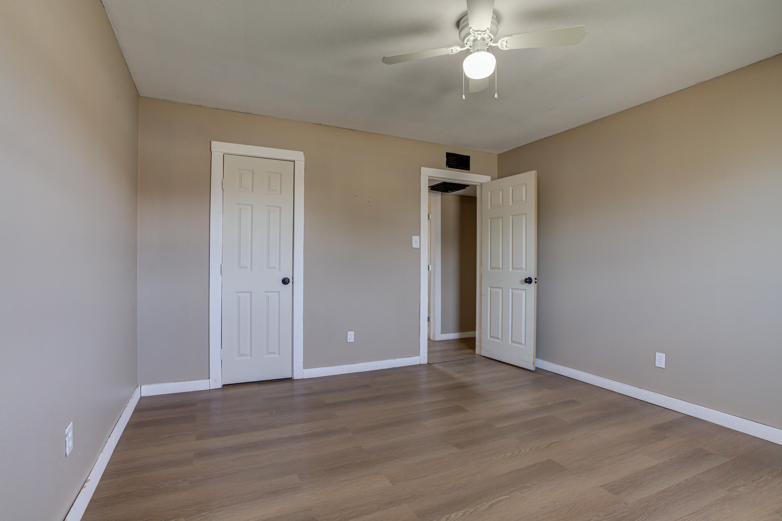 3204 East 2nd Street Lubbock, TX 79403 - Photo 26 of 34 a view of an empty room with wooden floor