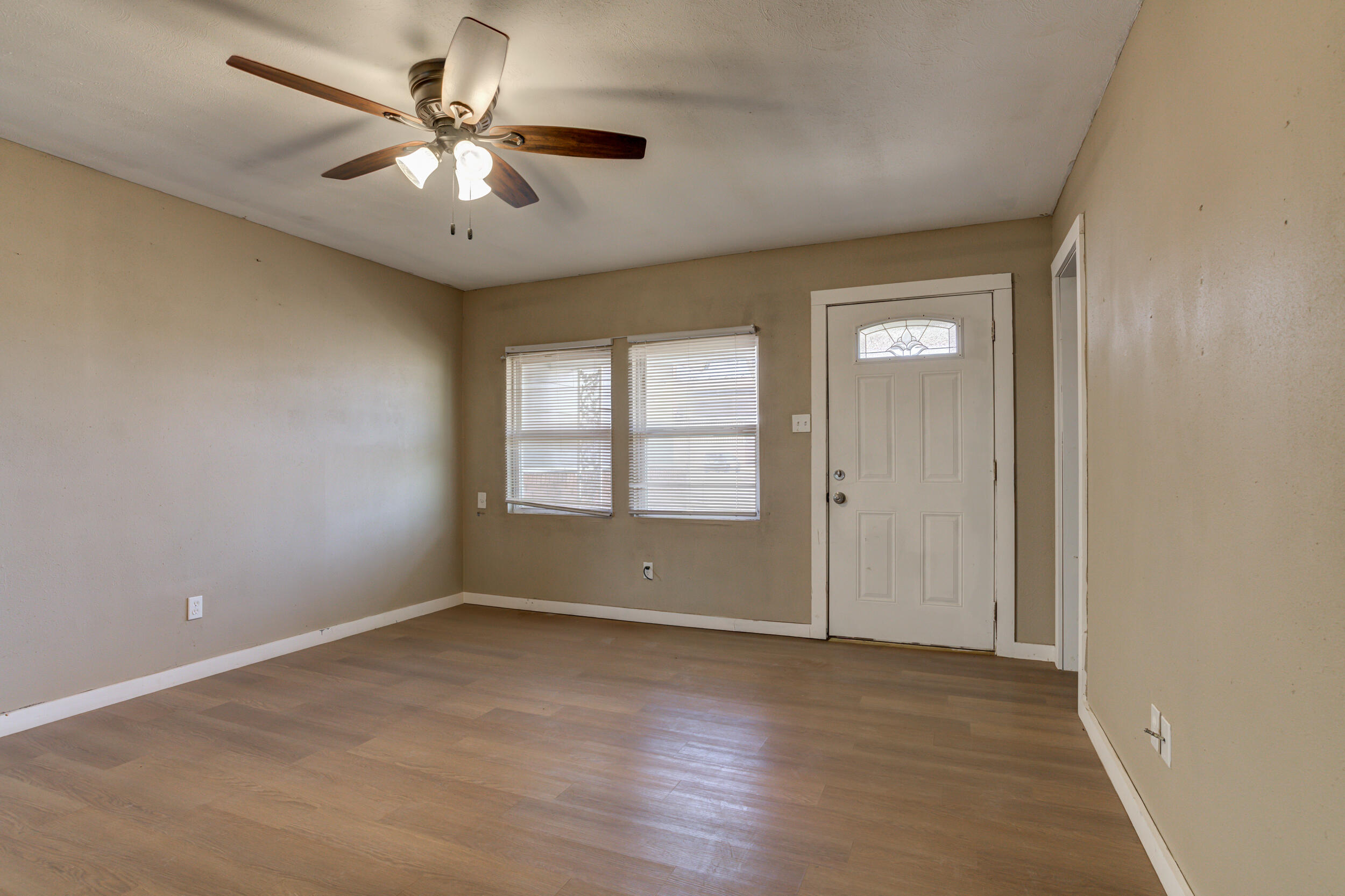 3204 East 2nd Street Lubbock, TX 79403 - Photo 6 of 34 wooden floor in an empty room with a window