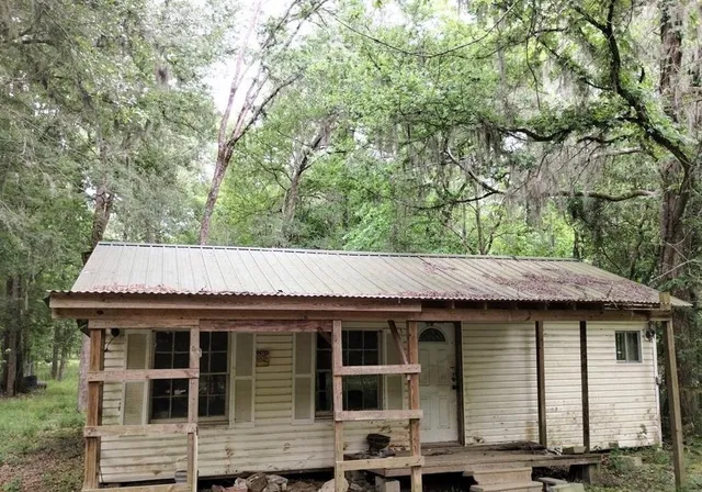 a backyard of a house with seating space