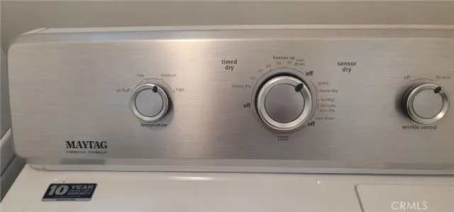 a bathroom with a toilet a sink and a mirror