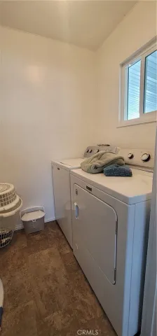 a bathroom with a toilet a sink and shower
