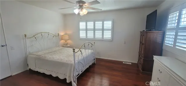 a spacious bathroom with a double vanity sink and a mirror