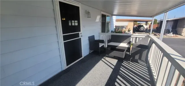 a view of a house with potted plants