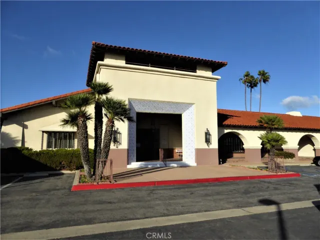 a view of a living room and dining room with hardwood floor