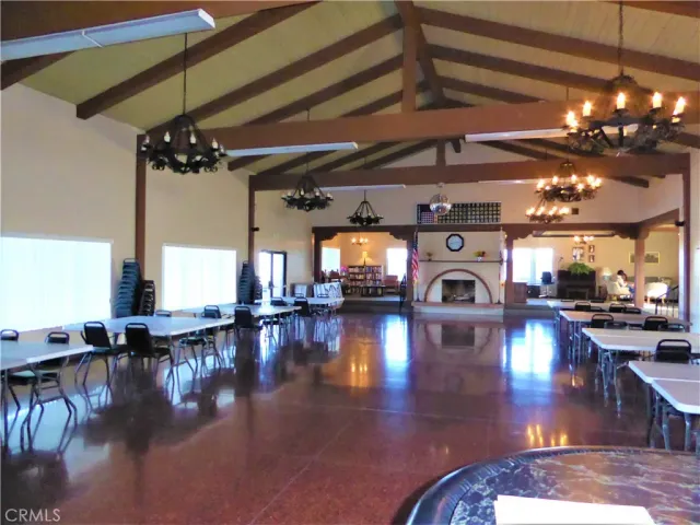 a room with pool table and windows