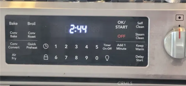 a kitchen with granite countertop a sink and a stove top oven