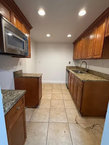 a bathroom with a toilet a sink and shower