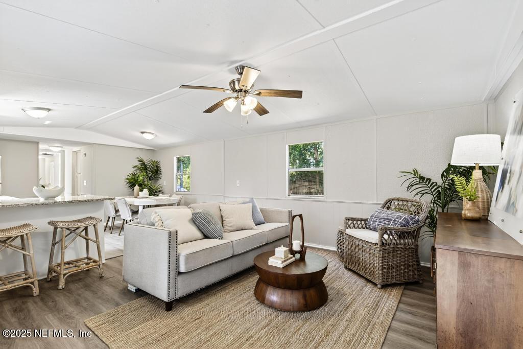 28 Neighbors Cove Road Orange Park, FL 32065 - Photo 11 of 56 a living room with furniture and a wooden floor