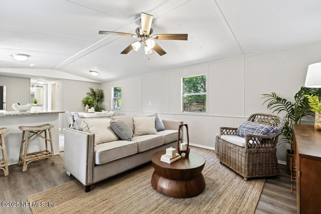 28 Neighbors Cove Road Orange Park, FL 32065 - Photo 12 of 56 a living room with furniture and a wooden floor