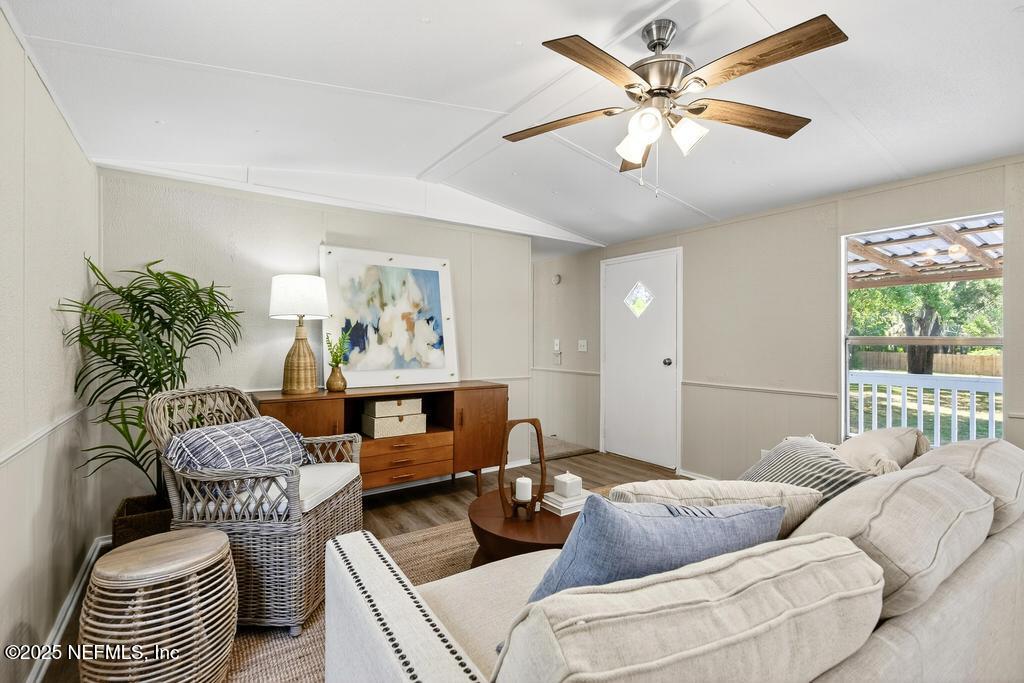 28 Neighbors Cove Road Orange Park, FL 32065 - Photo 16 of 56 a living room with furniture and a chandelier