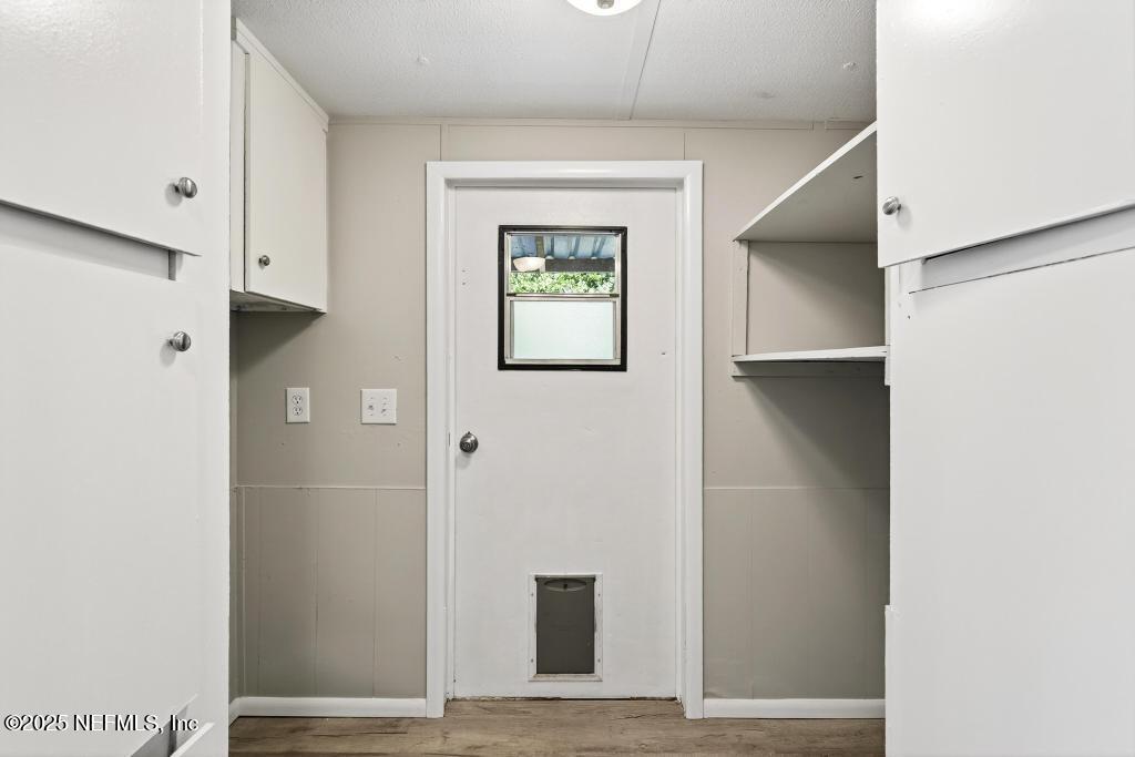 28 Neighbors Cove Road Orange Park, FL 32065 - Photo 27 of 56 a view of an entryway with wooden floor