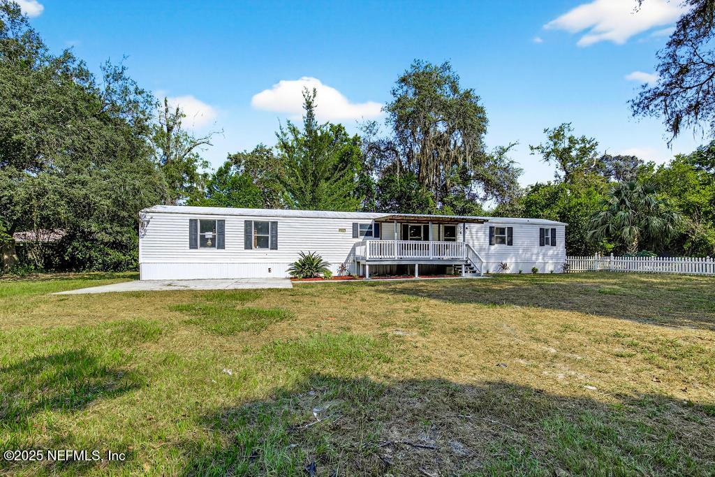 28 Neighbors Cove Road Orange Park, FL 32065 - Photo 3 of 56 a front view of a house with swimming pool having outdoor seating