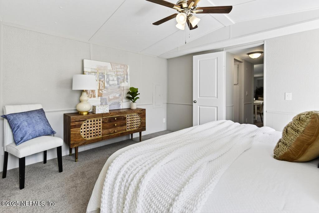 28 Neighbors Cove Road Orange Park, FL 32065 - Photo 36 of 56 a bedroom with a bed and a couch