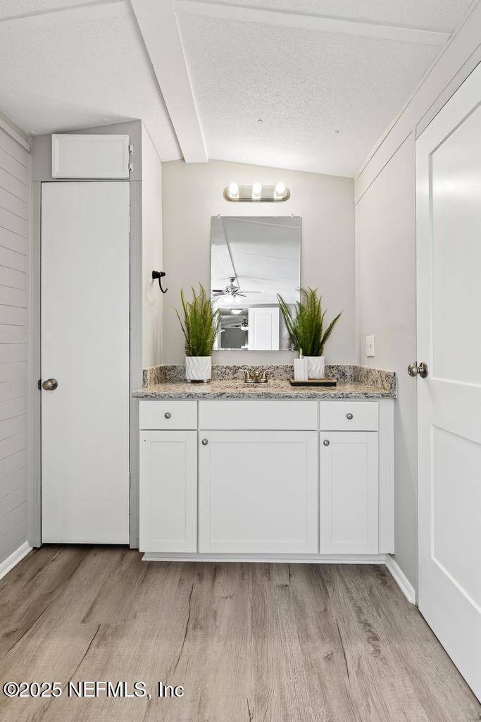 28 Neighbors Cove Road Orange Park, FL 32065 - Photo 39 of 56 a bathroom with a sink and a mirror